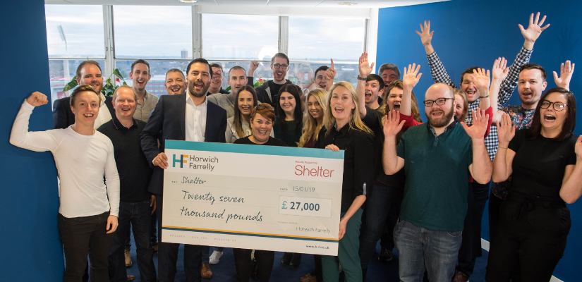 Group shot with big cheque