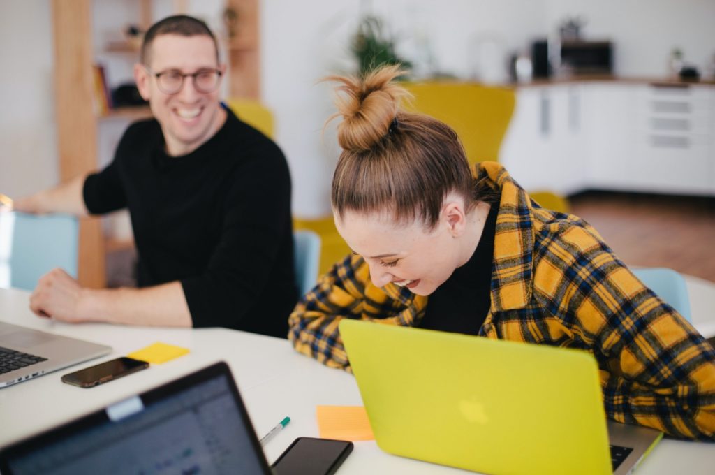 Colleagues laughing at work